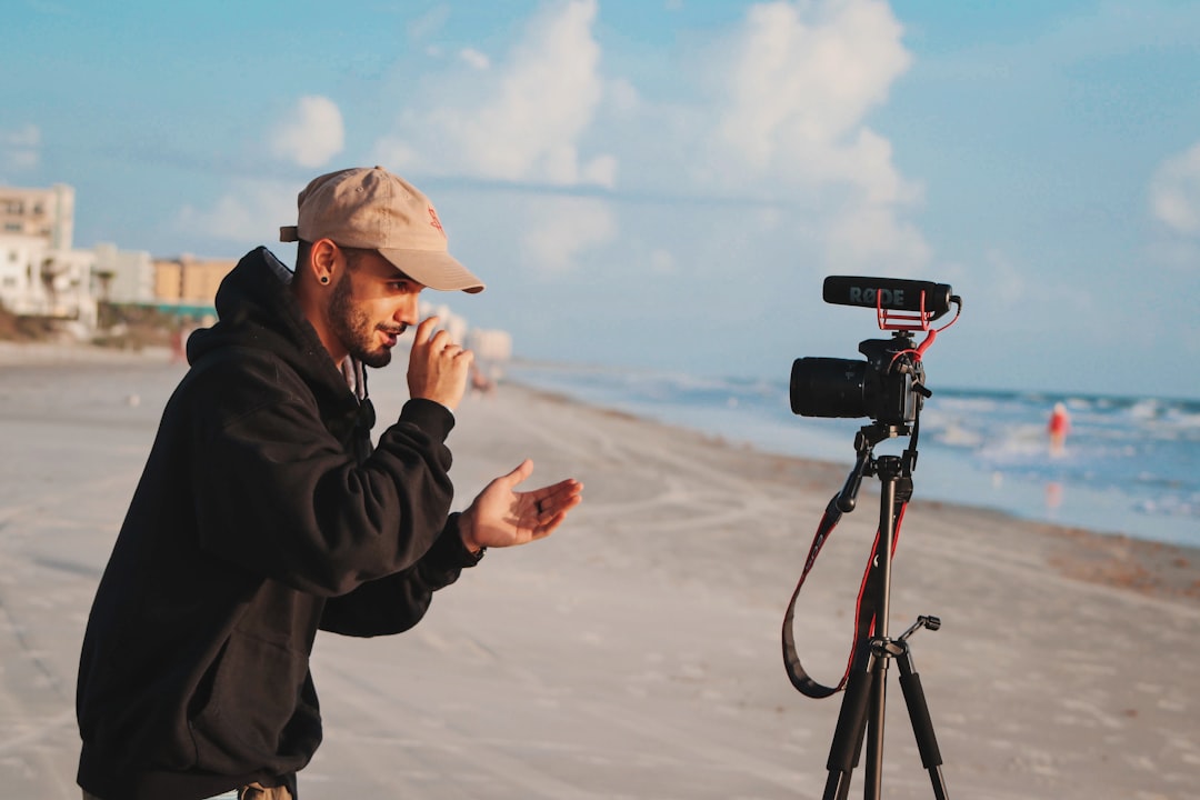 services-03 man-in-black-jacket-holding-camera-during-daytime-mfwsmddn-ro